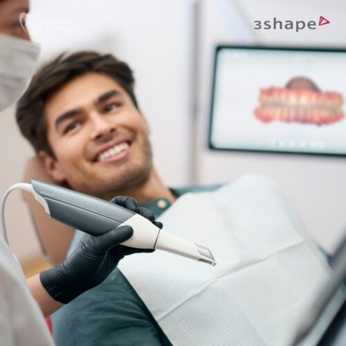 A dentist using an intraoral scanner on a patient.